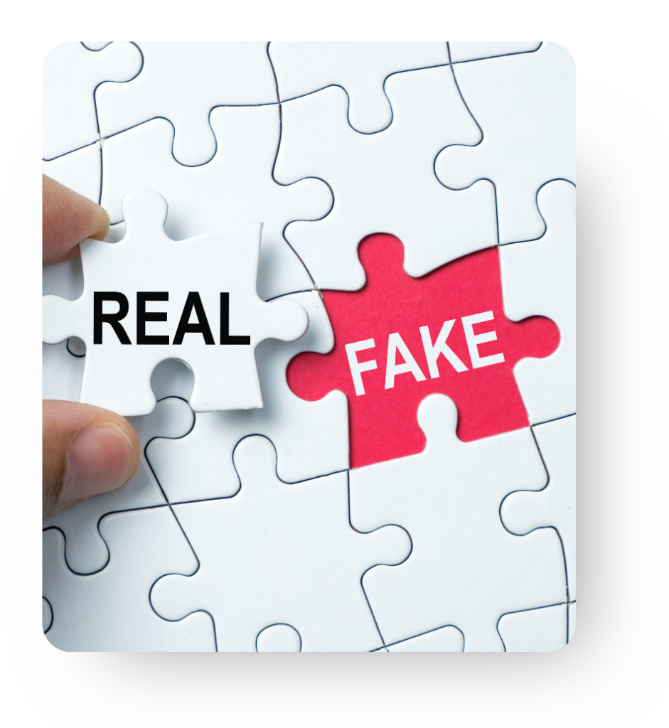 A person holding a white puzzle piece that says "Real" next to an open puzzle spot that is red and says "Fake".