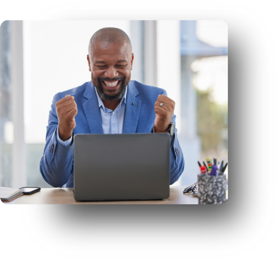 Man cheerfully looking at laptop