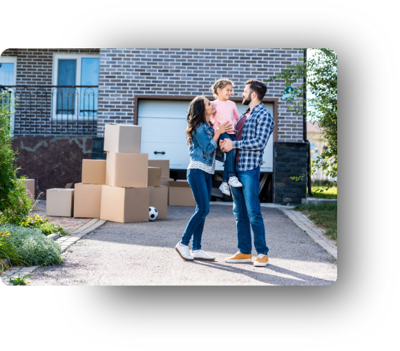 an man and women holding a childing in front of moving boxes